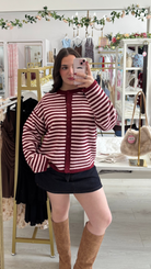 burgandy and pink striped cardigan, with mini skirt and brown boots