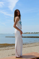 white linen pants with floral lace cut out 