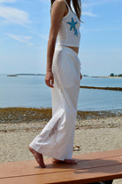white linen pants with floral lace cut out 