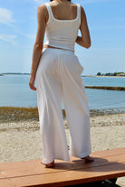 white linen pants with floral lace cut out 