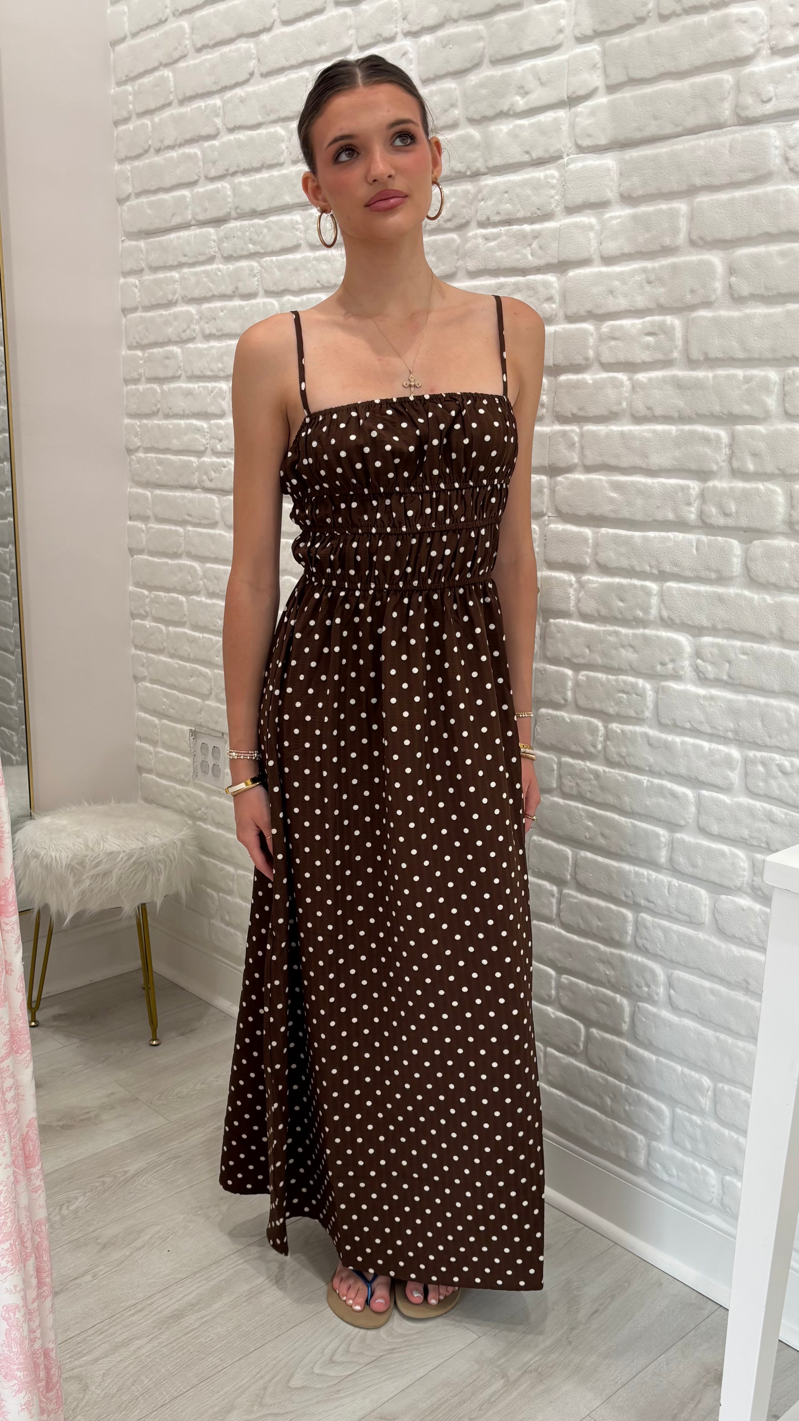 Person wearing a brown polka dot maxi dress. nice summer dress 